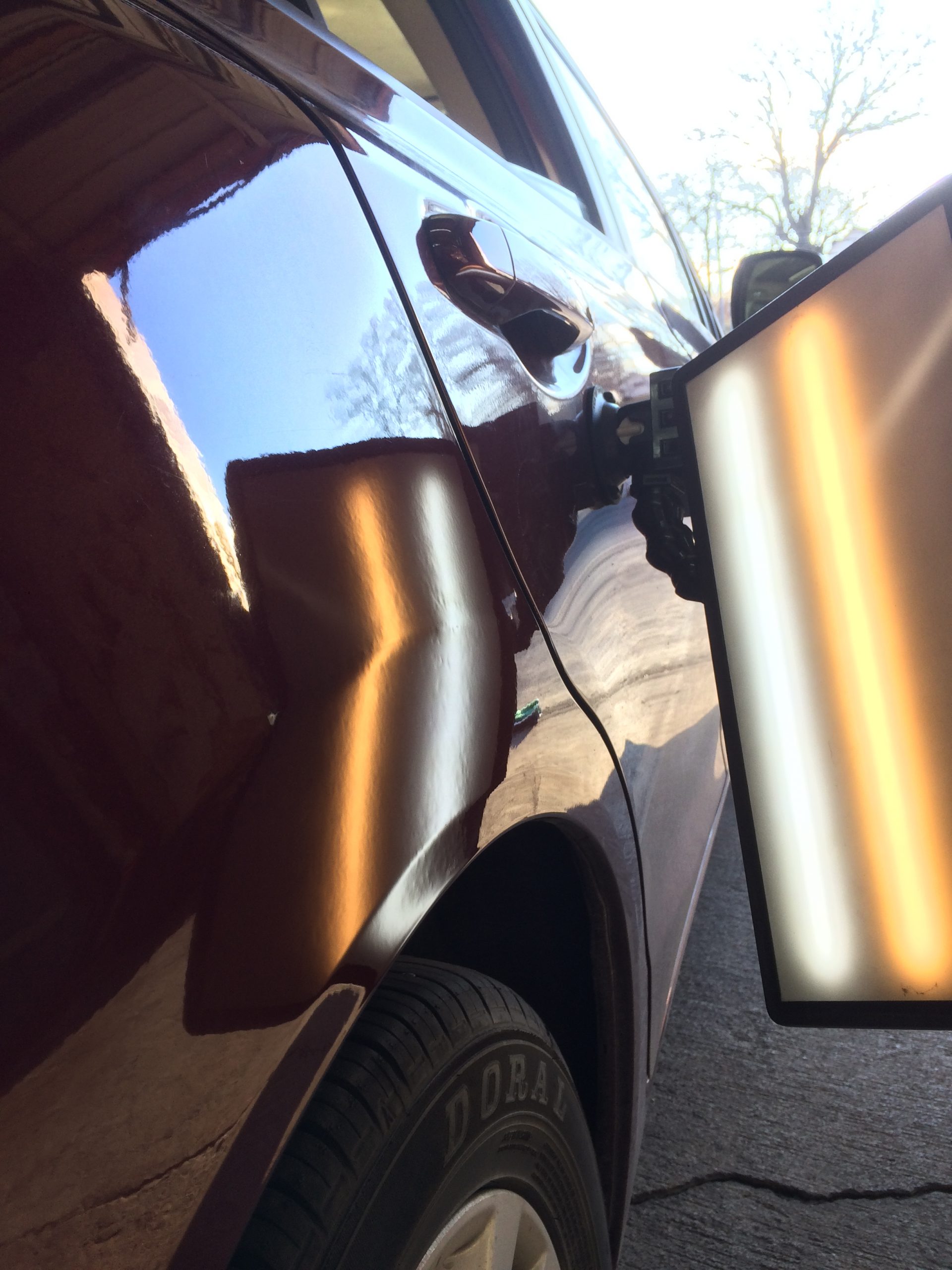 Vehicle panel restored to a factory reflection after paintless dent repair for a Nixa, MO driver